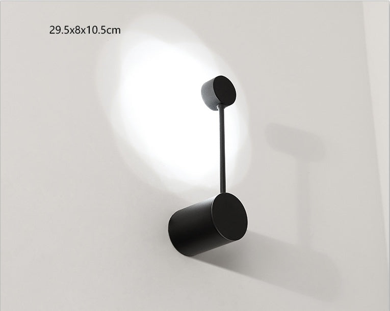 Black wall-mounted lamp on a white background
