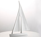 Sailboat-shaped lamp on a white background