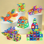 Colorful magnetic building blocks on white cylindrical stands against a beige background