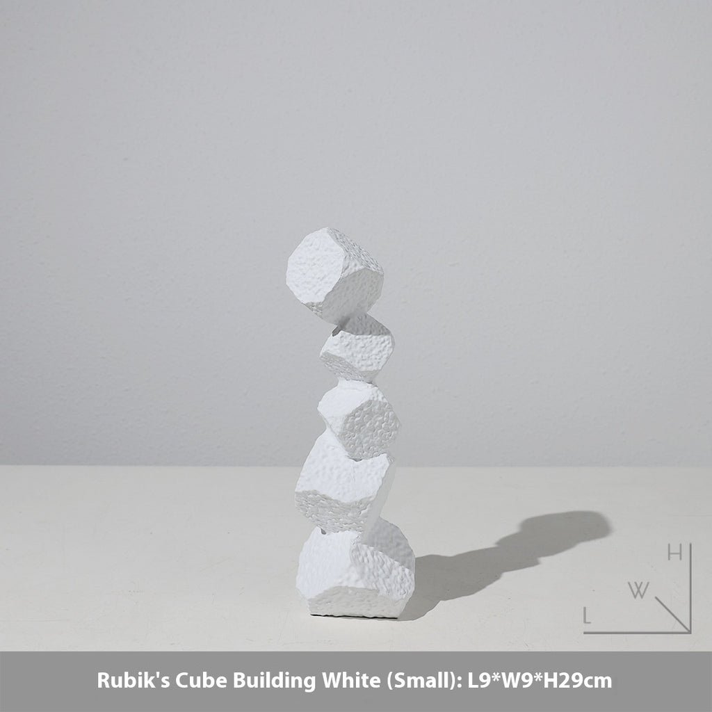 Stack of white geometric blocks on a light gray background