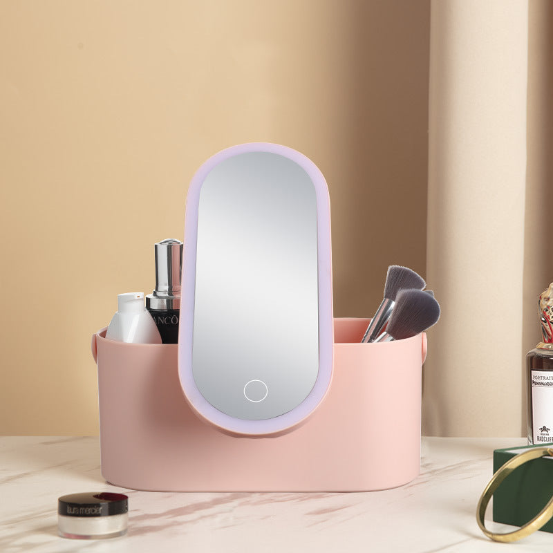 Pink makeup organizer with a mirror on a beige surface