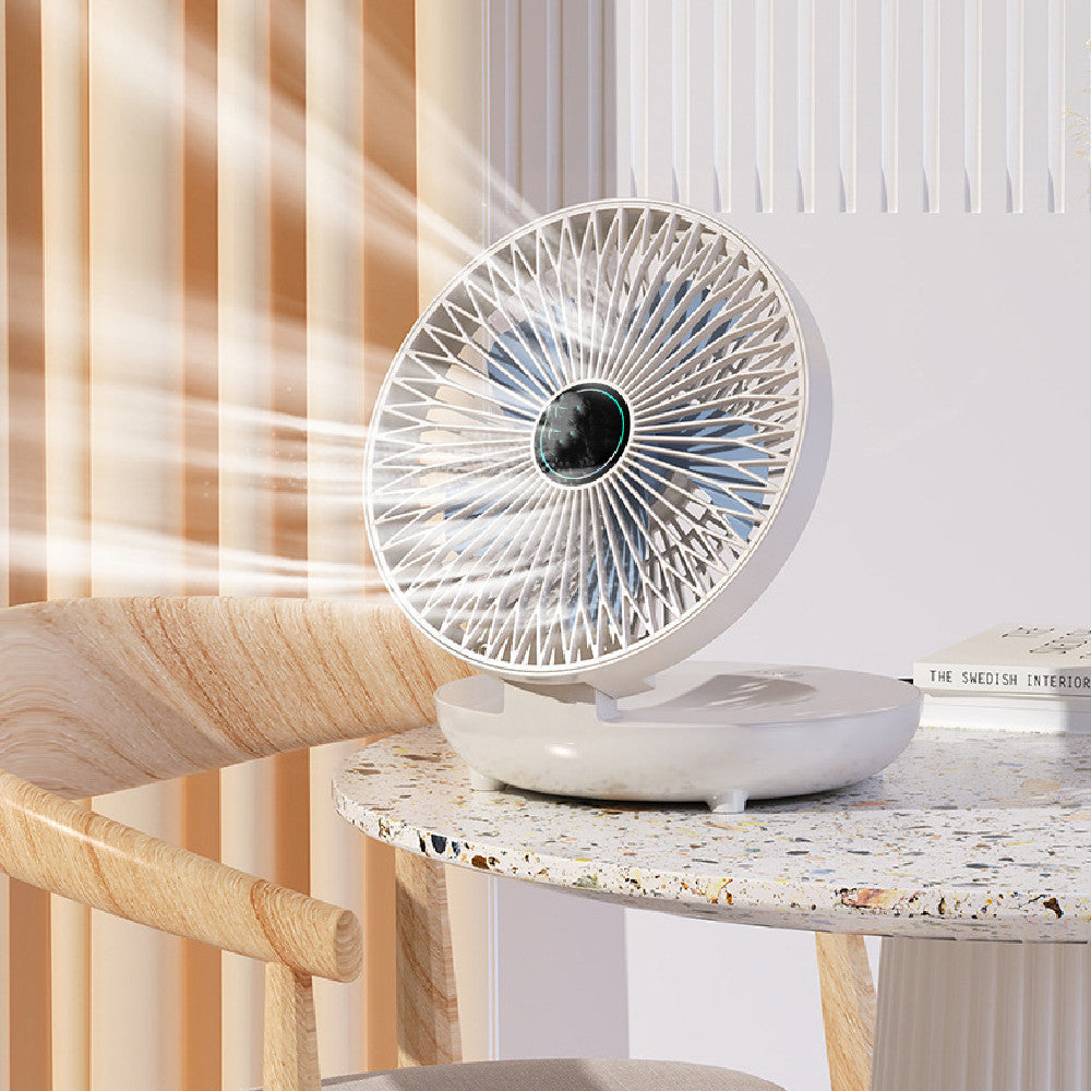 White portable fan on a marble table with a blurred background