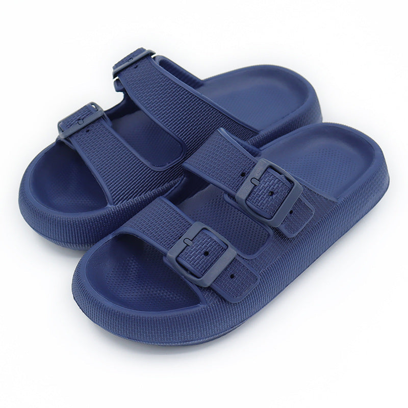 Pair of blue sandals with buckle straps on a white background