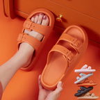 Orange sandals being worn on a bright orange background with additional sandals displayed.
