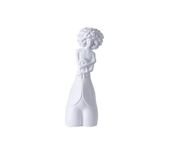 White ceramic sculpture of a child on a white background