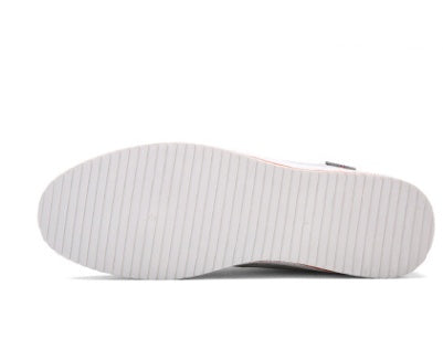 White sole of a shoe on a white background