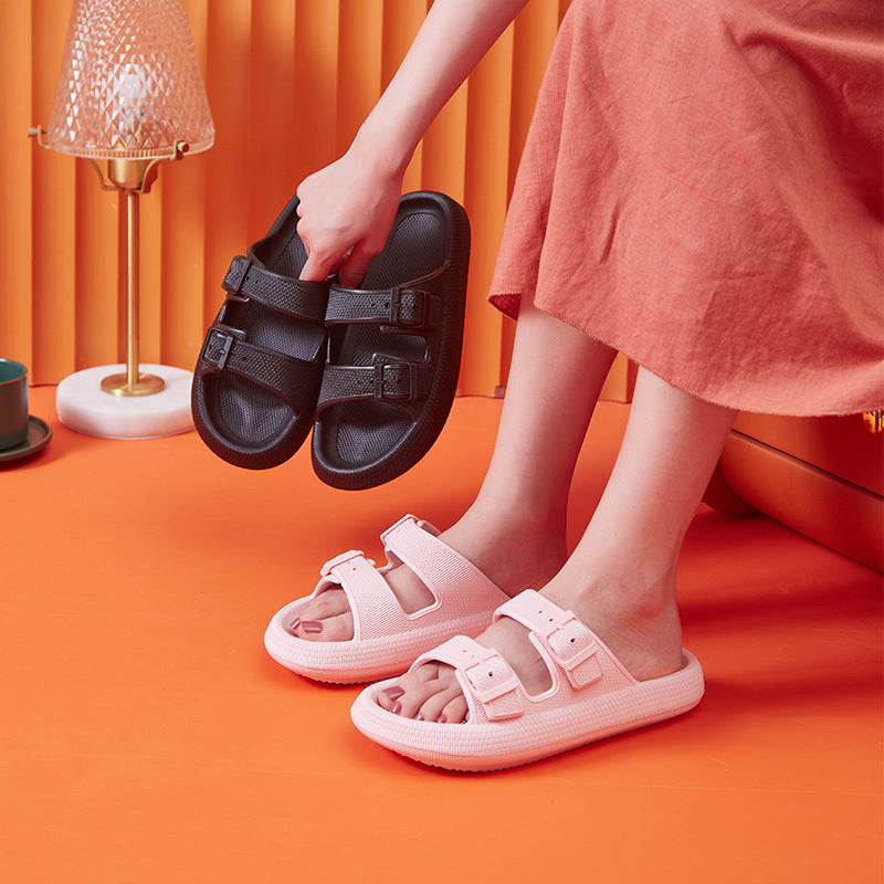 Person wearing pink sandals on an orange background