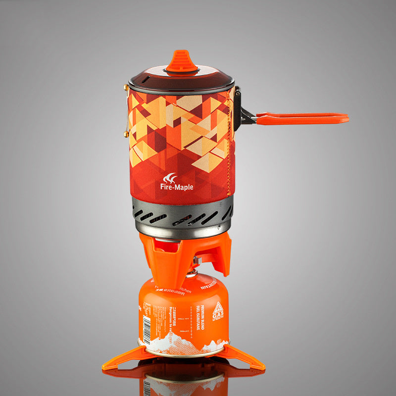 Orange camping stove with geometric pattern on a gray background