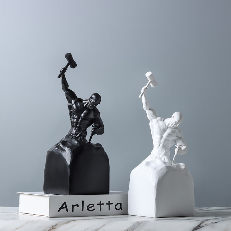 Black and white sculptures on a gray background with 'Arletta' branding.