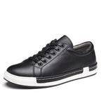 Black leather sneaker with white sole on a white background
