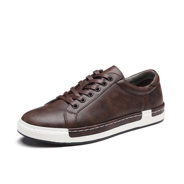 Brown leather sneaker with white sole on a white background