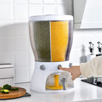 Kitchen appliance with a person using it on a kitchen counter.