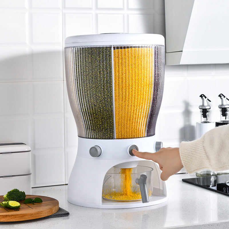 Kitchen appliance with a person using it on a kitchen counter.