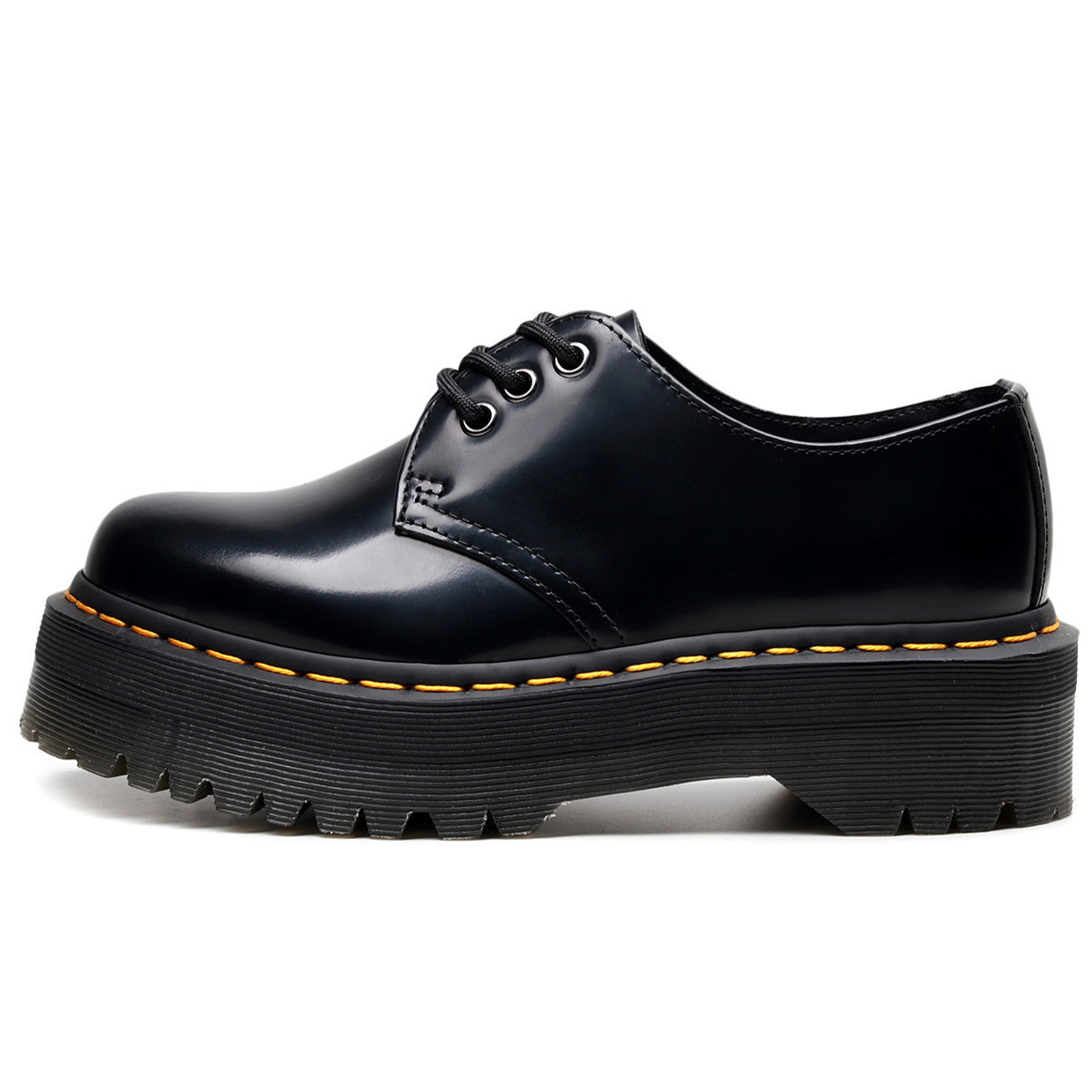 Black leather shoe with yellow stitching on a white background