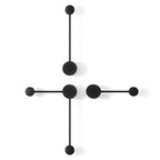 Modern wall clock with black circular design on a white background
