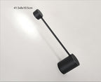 Black wall-mounted light fixture on a white background with dimensions displayed.