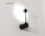 Black wall-mounted lamp on a white background