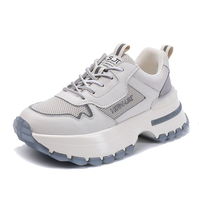 White and gray sneaker with thick sole on a white background