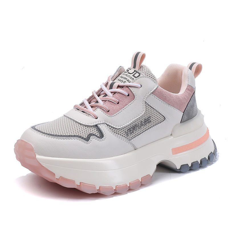 Pink and gray sneaker with a thick sole on a white background