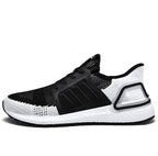 Black and white sneaker with Adidas logo on a white background