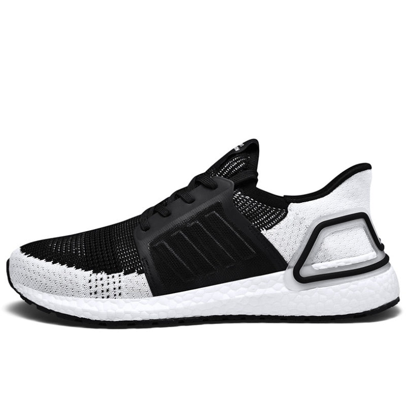 Black and white sneaker with Adidas logo on a white background