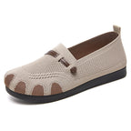 Beige casual shoe with brown accents on a white background