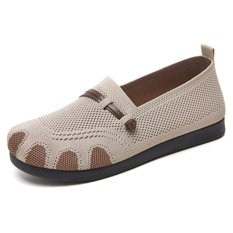 Beige casual shoe with brown accents on a white background