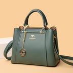 Green handbag with a brand logo on a beige background
