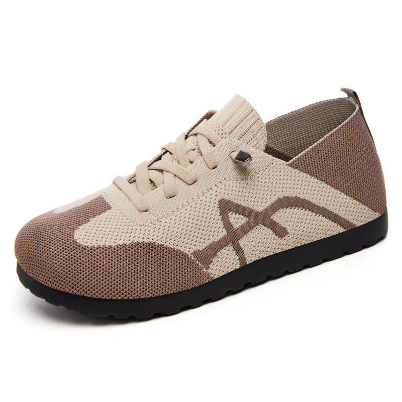 Beige and brown sneaker with a brand logo on a white background