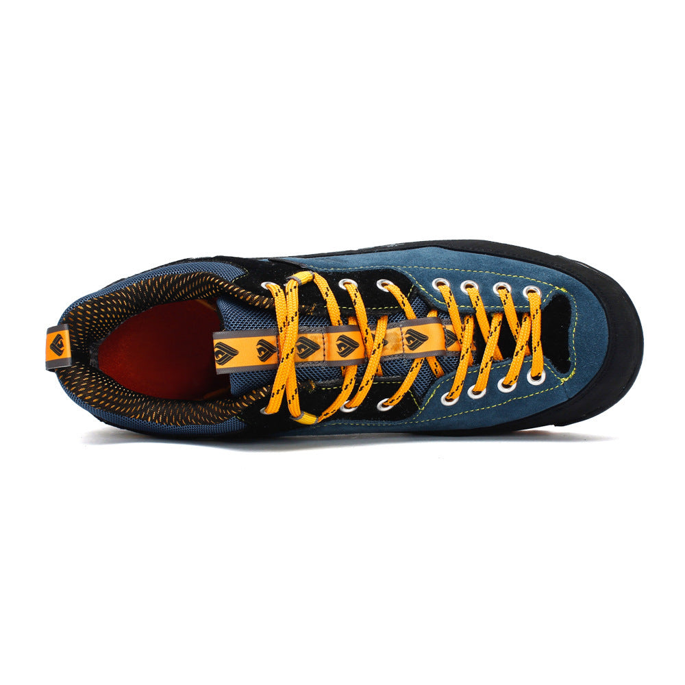 Blue and black sneaker with yellow laces on a white background