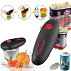 Black can opener with red buttons next to canned goods and oranges on a white background