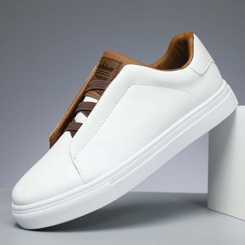 White sneaker with brown accents on a gray background