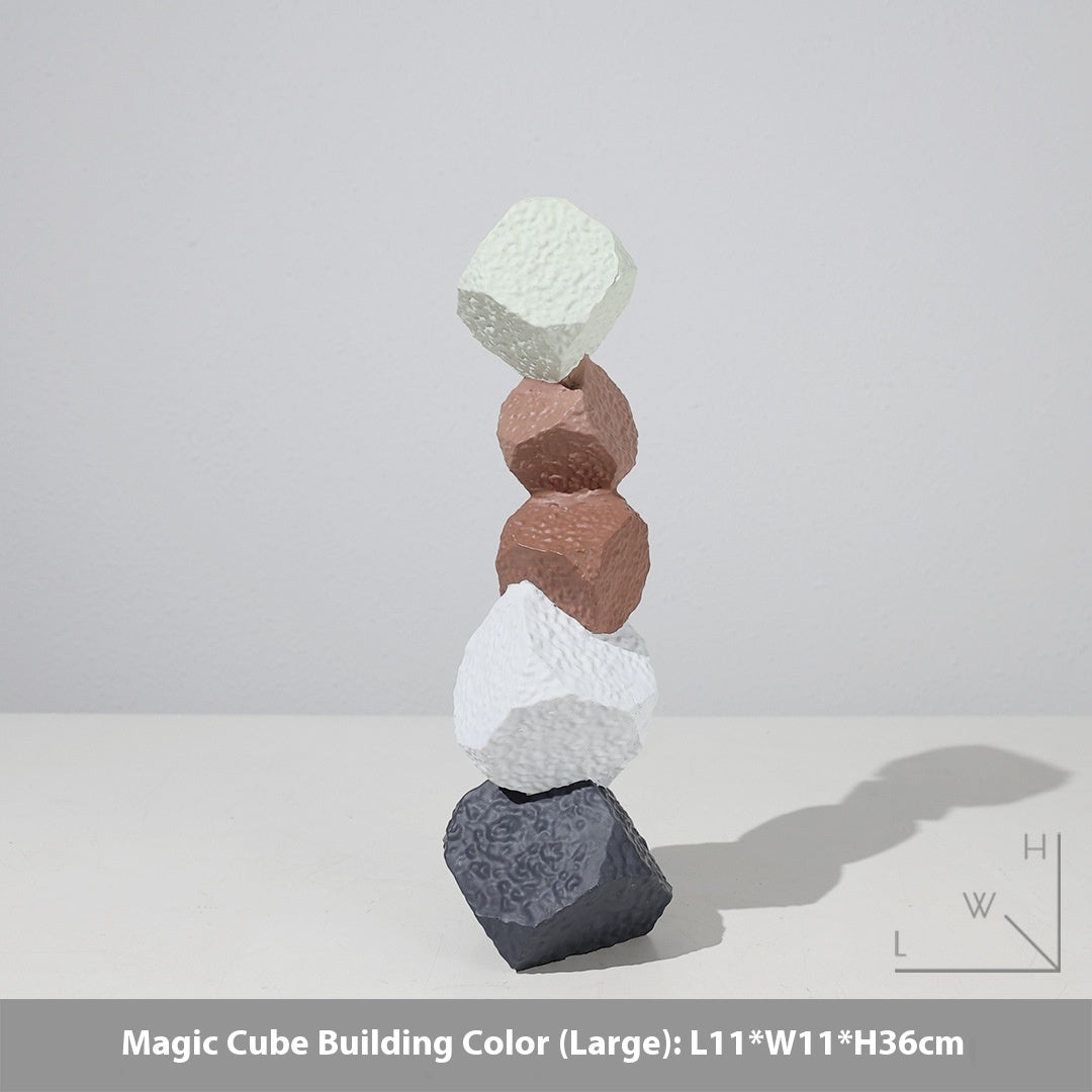 Stack of colorful geometric blocks on a light gray background