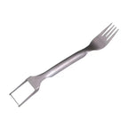 Metallic fork with a scraper attachment on a white background