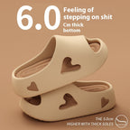 Beige clogs with heart designs on a brown background, featuring text about thickness.