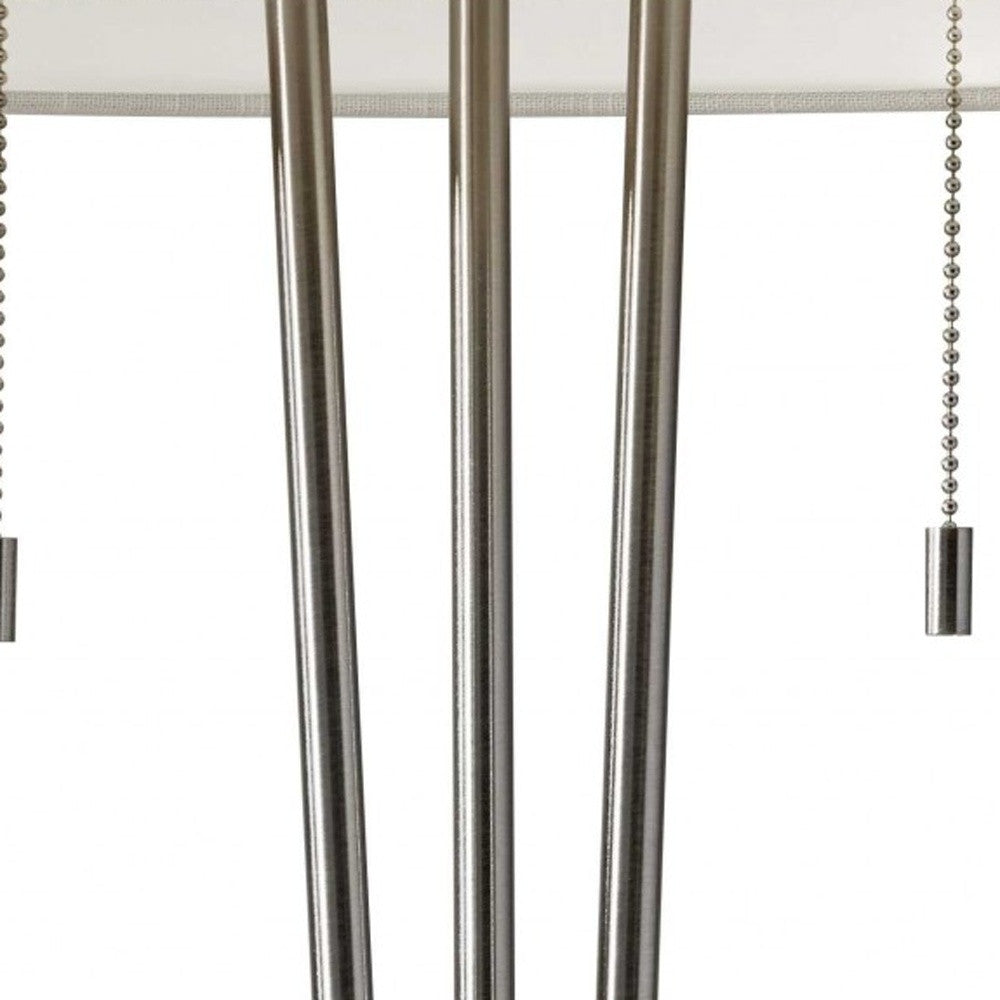 Close-up of metallic curtain rods with white shade on a white background