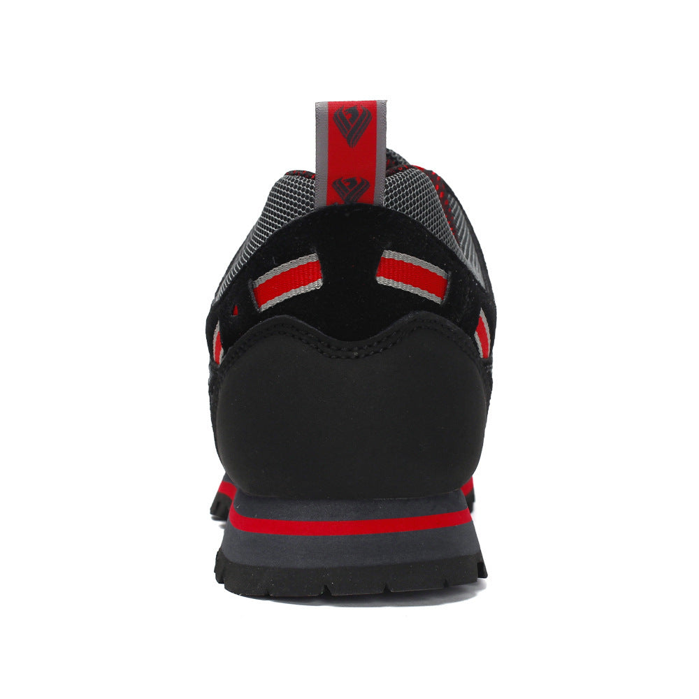 Black and red athletic shoe on a white background