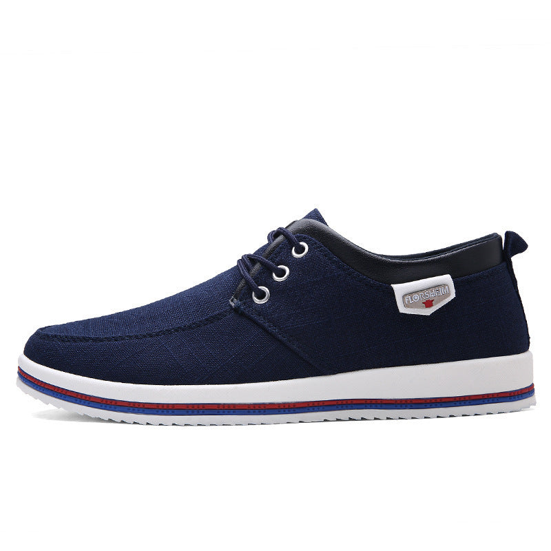 Navy blue casual shoe with white sole on a white background