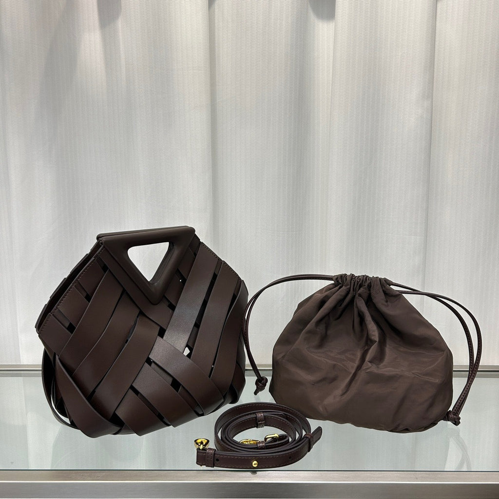 Brown woven handbag, drawstring pouch, and belt on a light gray background