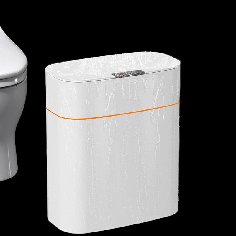 White cylindrical water heater with orange accent in a bathroom setting