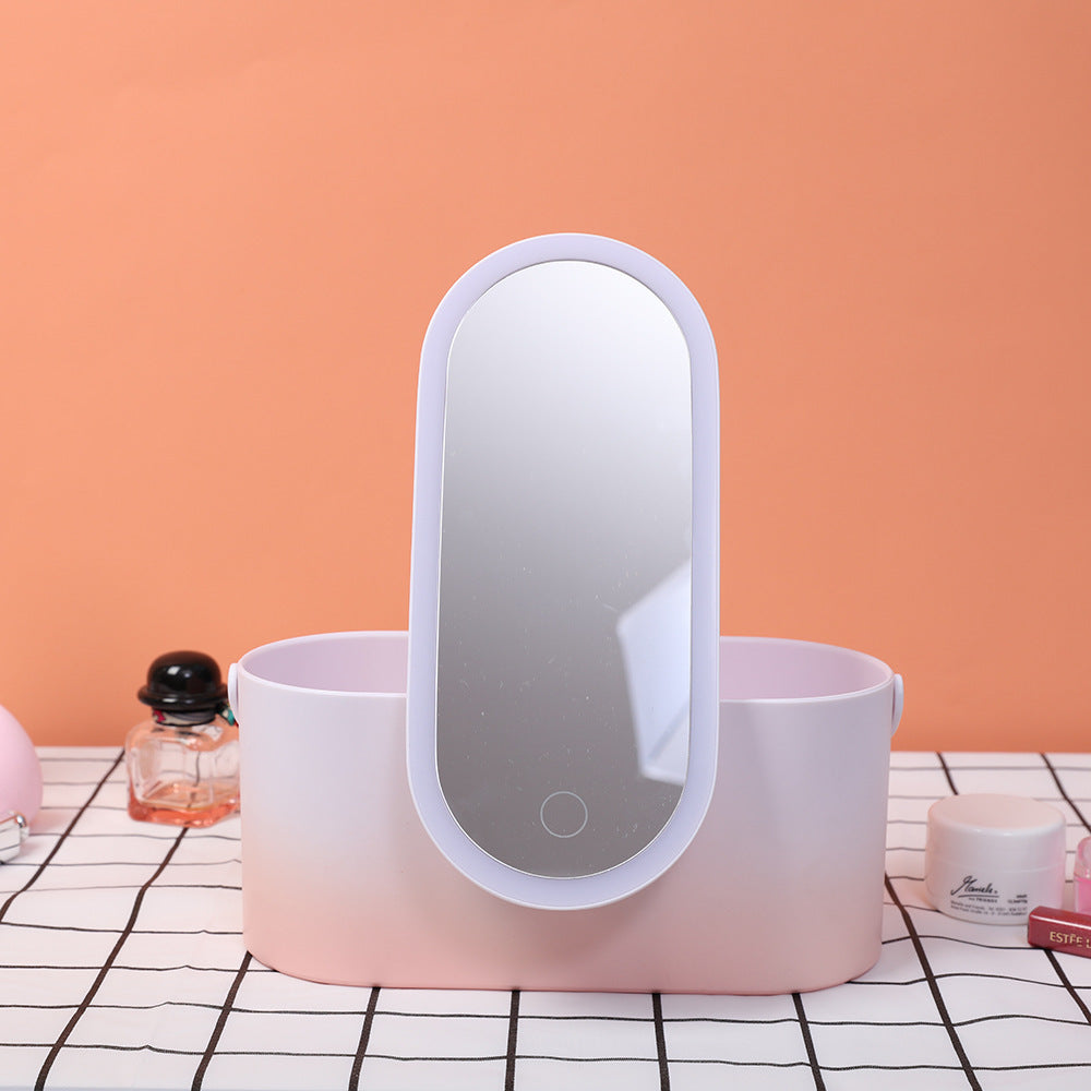 Pink vanity mirror with light on a checkered tablecloth against an orange wall