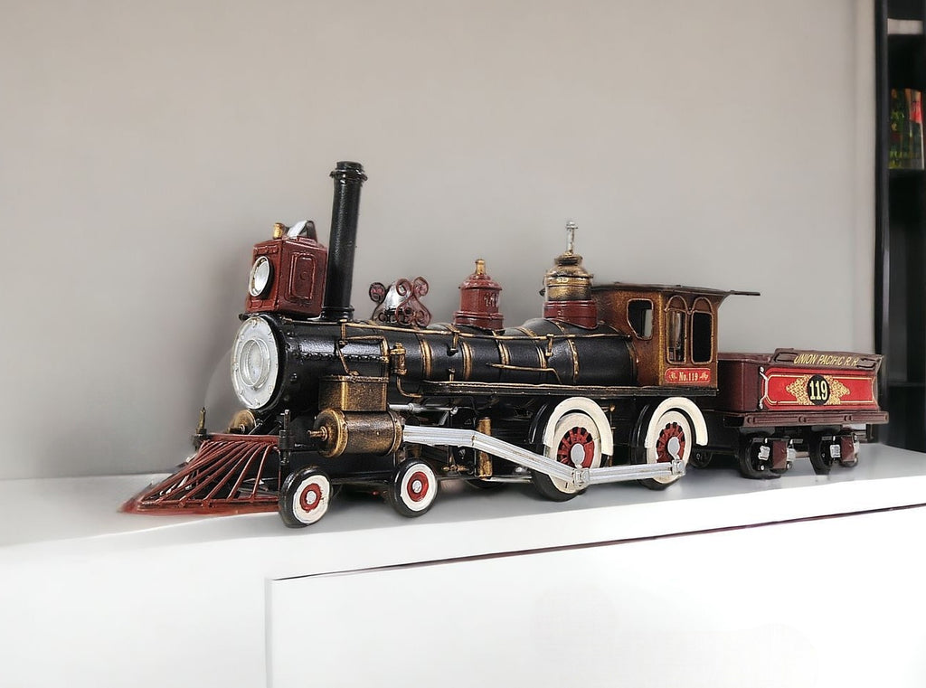 Model steam locomotive on a white surface with a neutral background