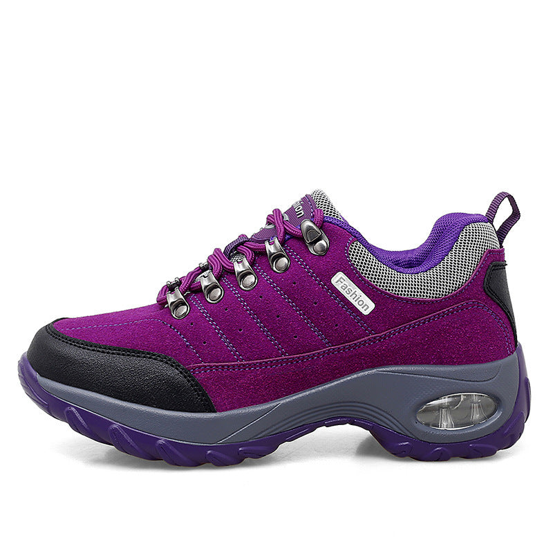 Purple and gray sneaker with visible brand logo on a white background
