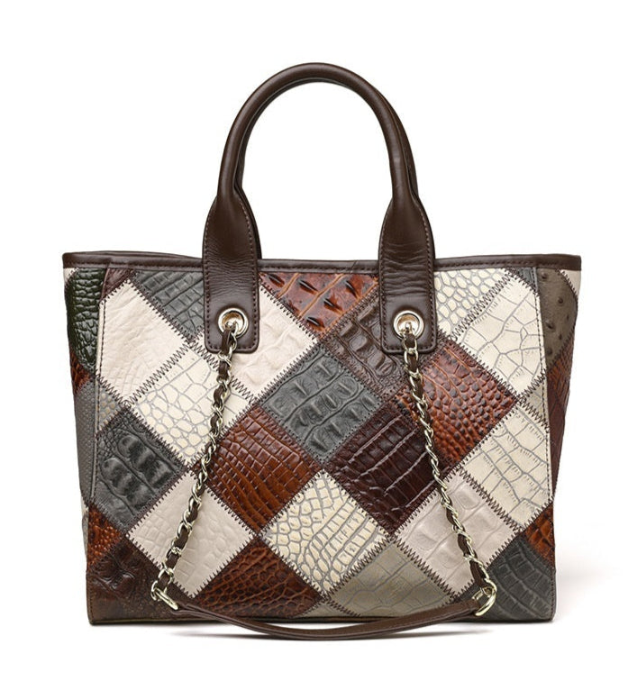 Patchwork handbag with brown, gray, and white pattern on a white background