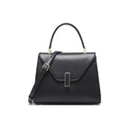 Black handbag with gold accents on a white background
