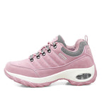 Pink sneaker with white sole on a white background