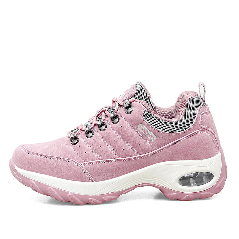 Pink sneaker with white sole on a white background