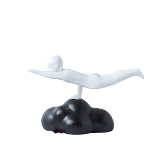 White bird-like figure on a black cloud-like base against a white background