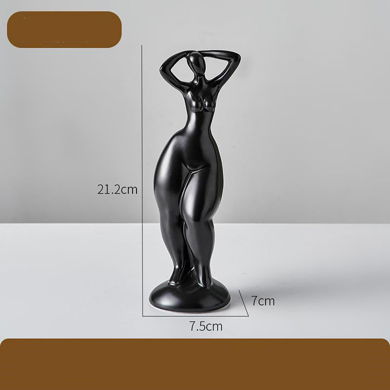 Black abstract sculpture with measurements on a gray background