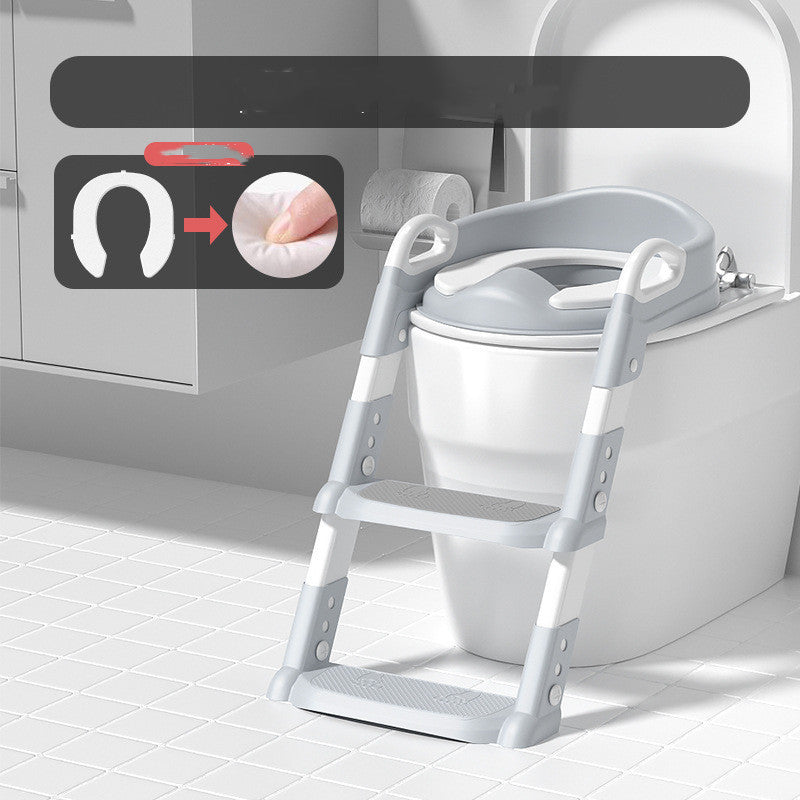 Children's toilet training seat with step ladder attached to a toilet in a bathroom setting.